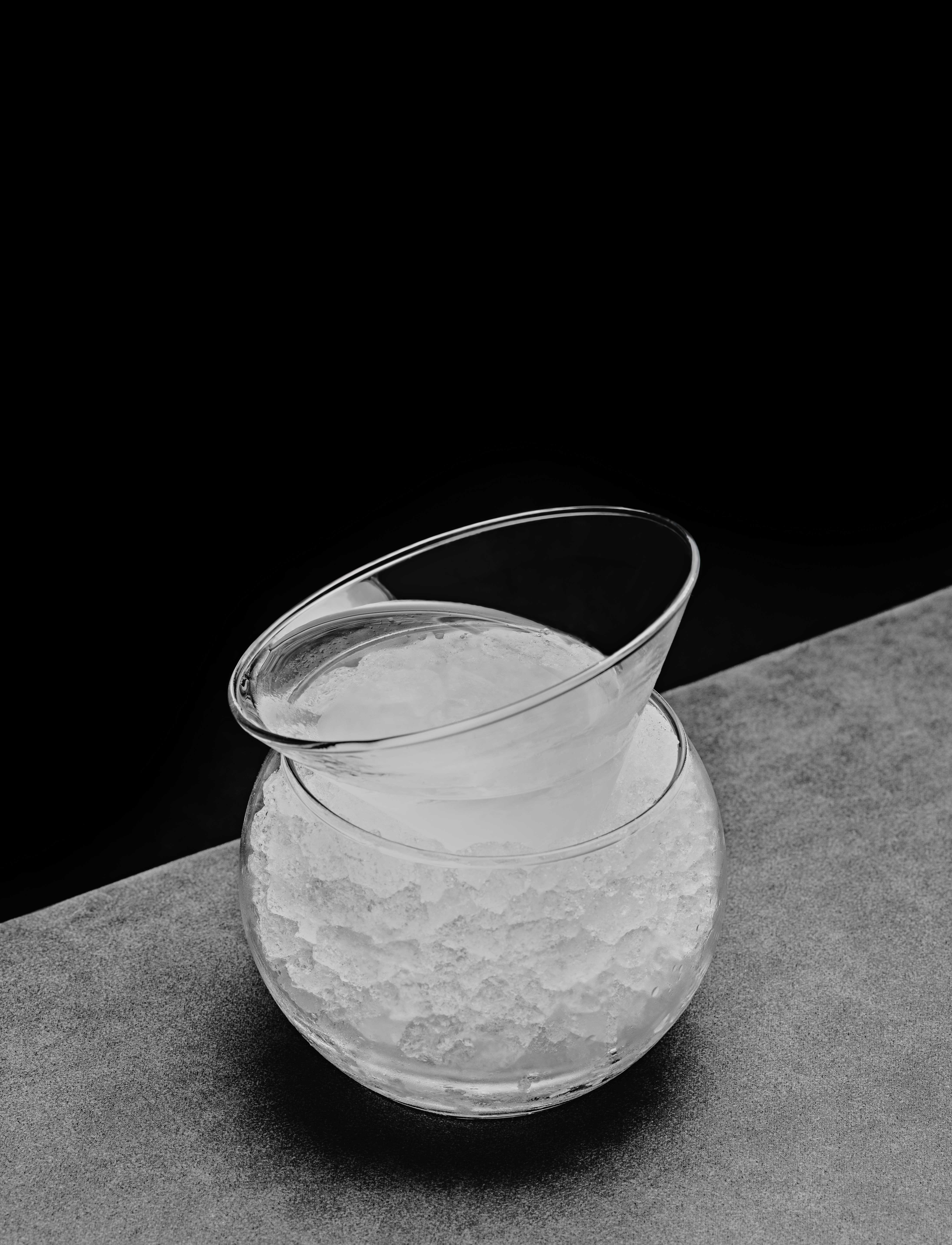 photo of a cocktail served in a round glass with lots of ice.